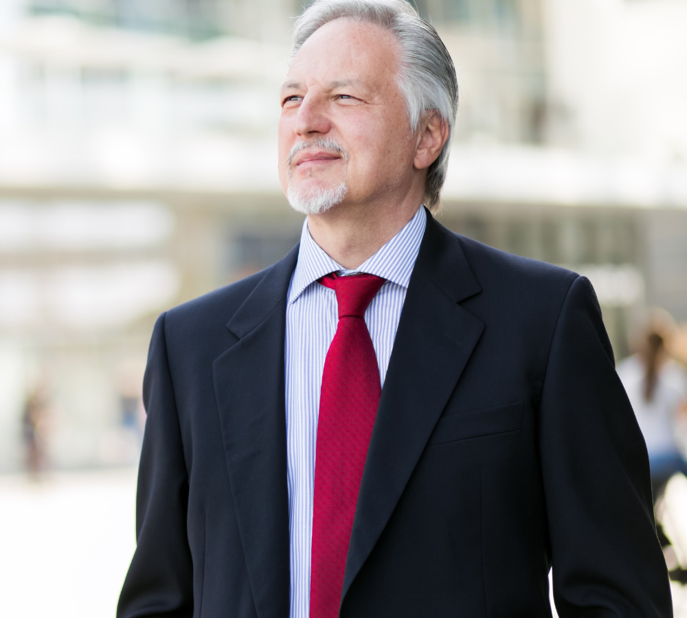 Man with jacket and red tie