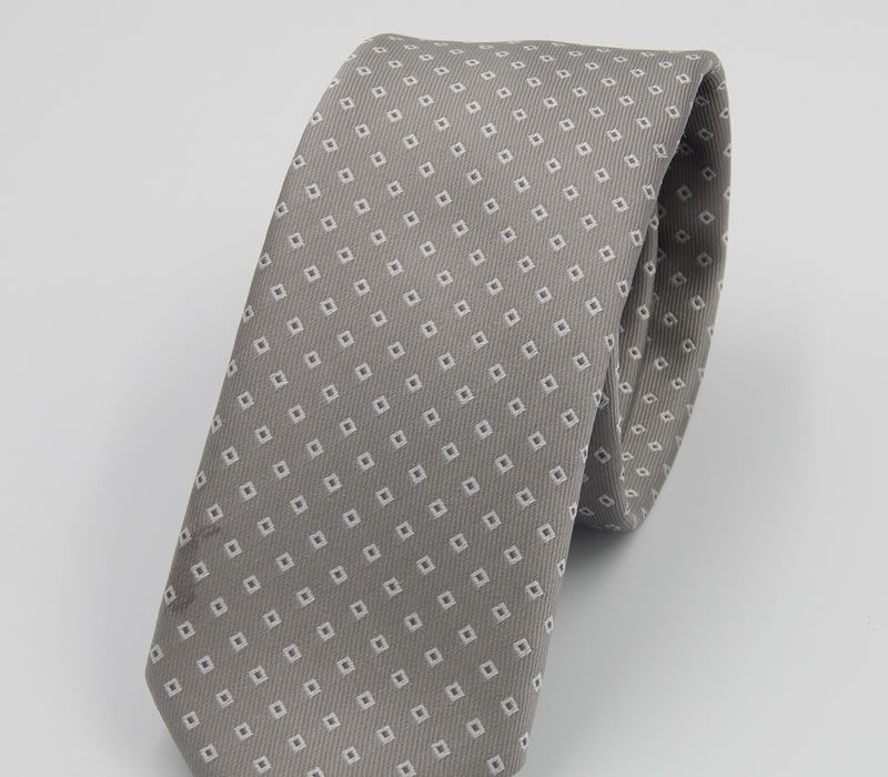 Handmade 100% gray silk tie with white motifs